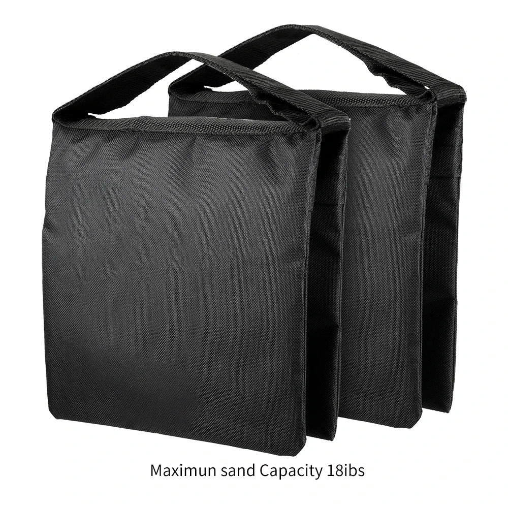 Two black fabric sandbags with handles for stabilizing photography or video equipment weighing up to 18 pounds each