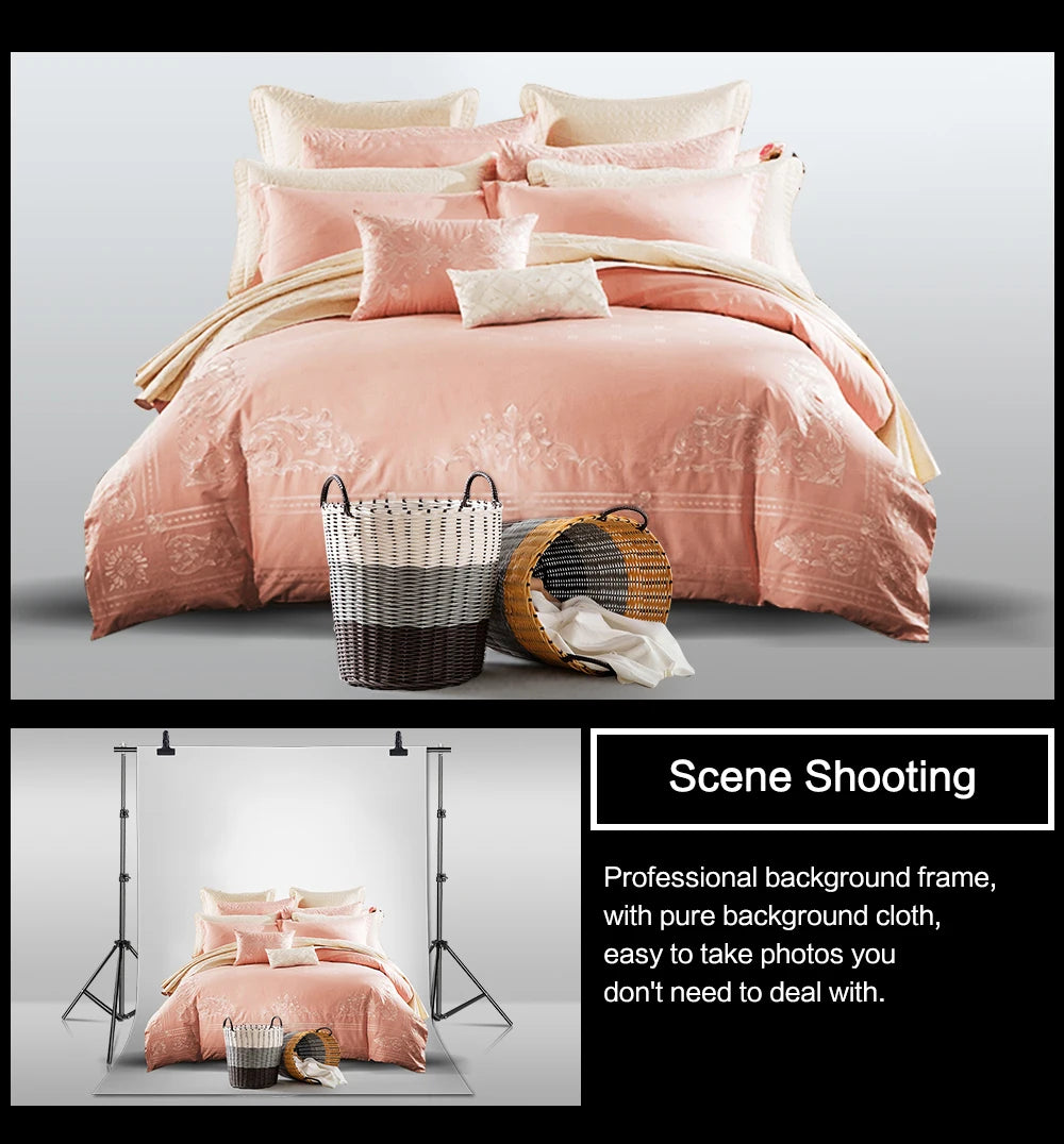 Professional photo studio setup with adjustable backdrop frame, soft pink bedding, and decorative baskets in front