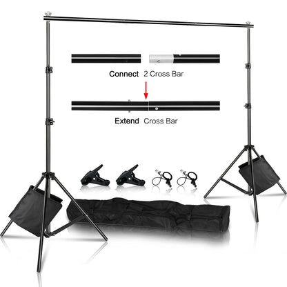 Black adjustable aluminum backdrop support system with two tripod stands, clamps, and a carrying case on white background