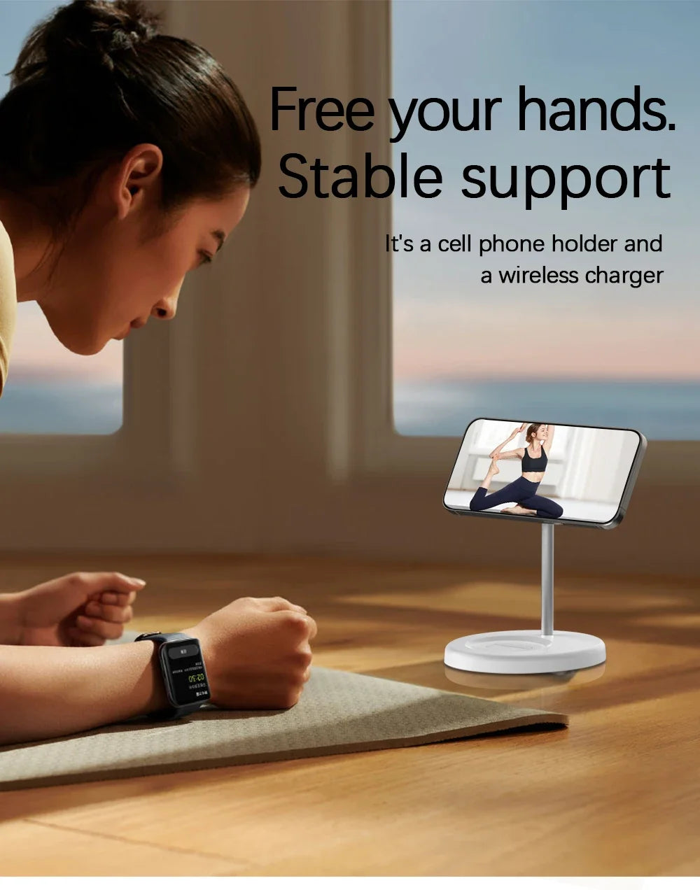 Woman doing plank exercise watching phone on a white magnetic wireless charging stand on wooden floor