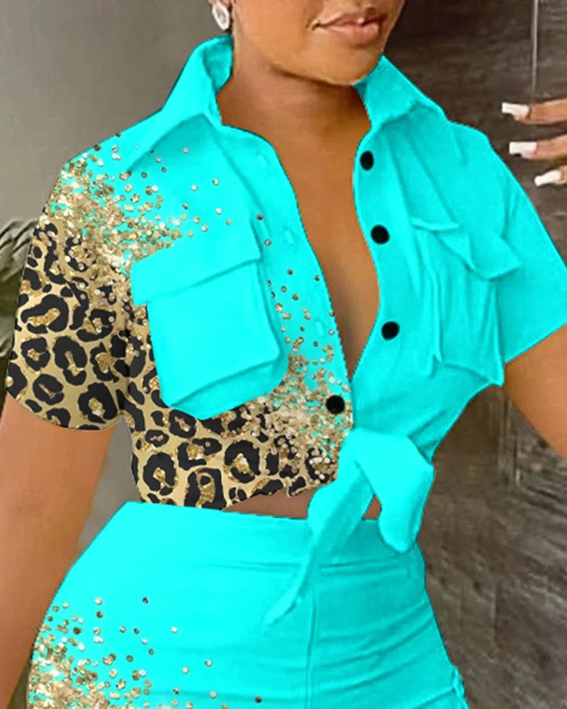 Woman wearing a turquoise and leopard print two-piece summer outfit with a tied short-sleeve top and matching shorts