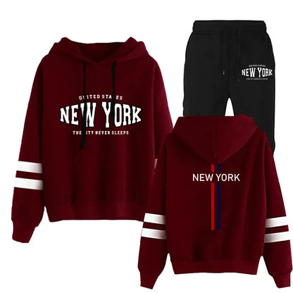 Woman's two-piece jogging set with maroon hooded sweatshirt featuring white stripes and black drawstring shorts with New York print