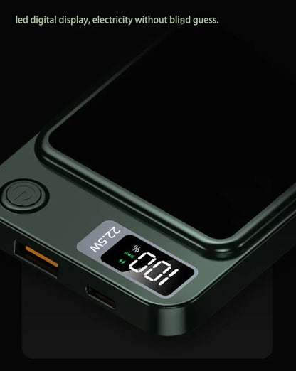 Close-up of black power bank with LED digital display showing battery percentage and power icon