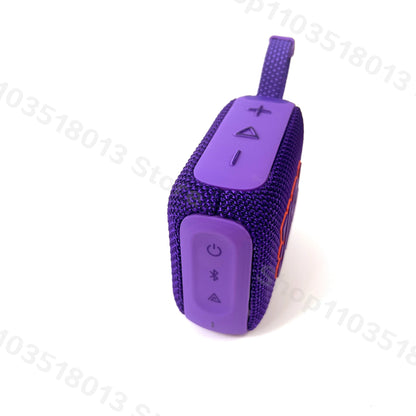 Purple JBL GO 4 portable Bluetooth speaker with textured fabric surface and control buttons on top against white background