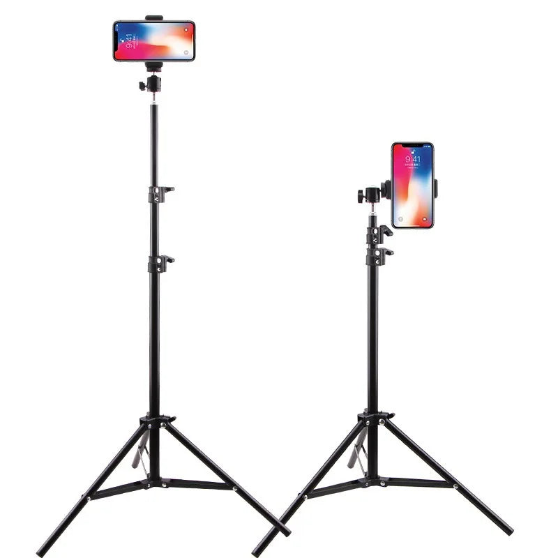 Two black adjustable phone tripod stands holding smartphones on white background