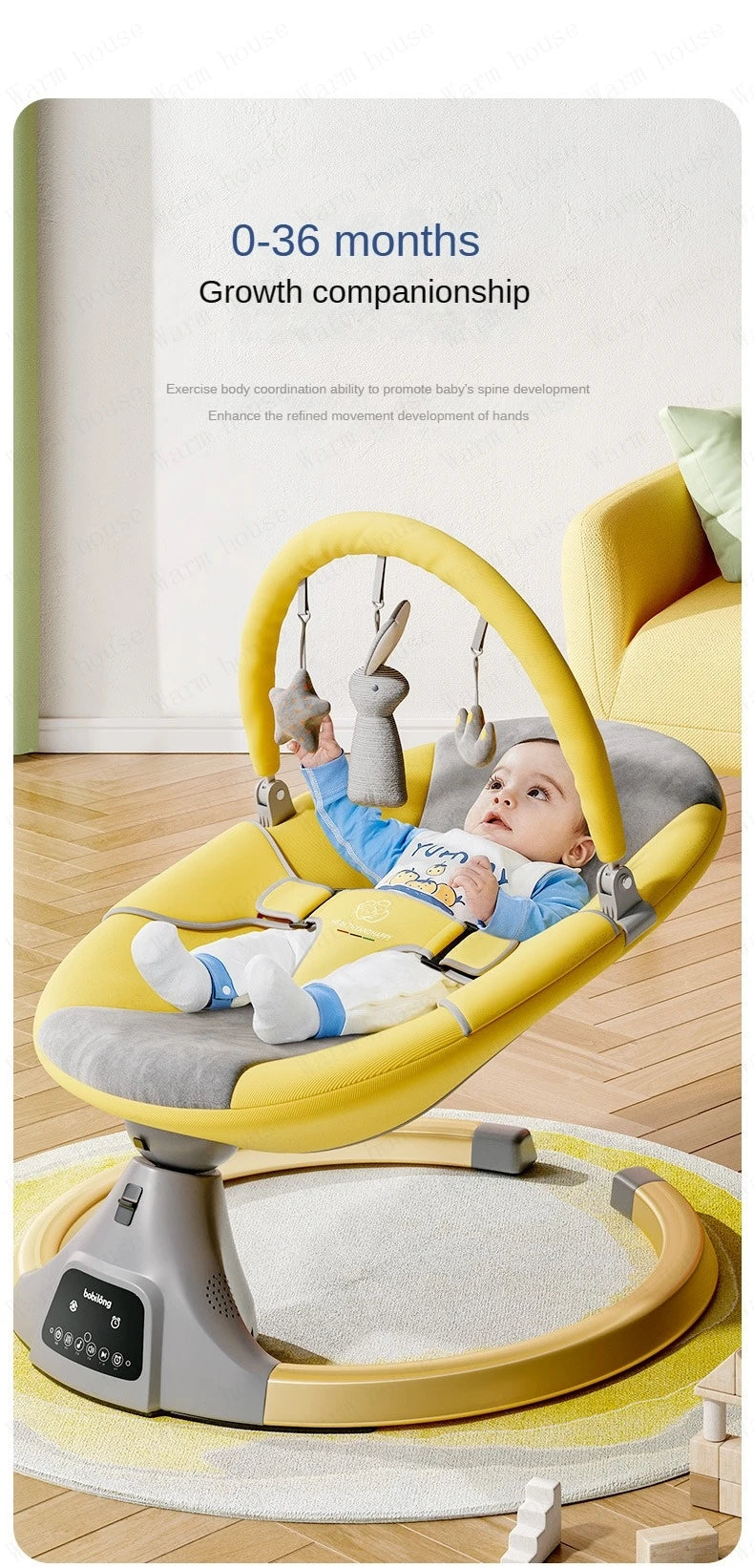 Baby lying in yellow and grey electric rocking chair playing with hanging plush toys indoors