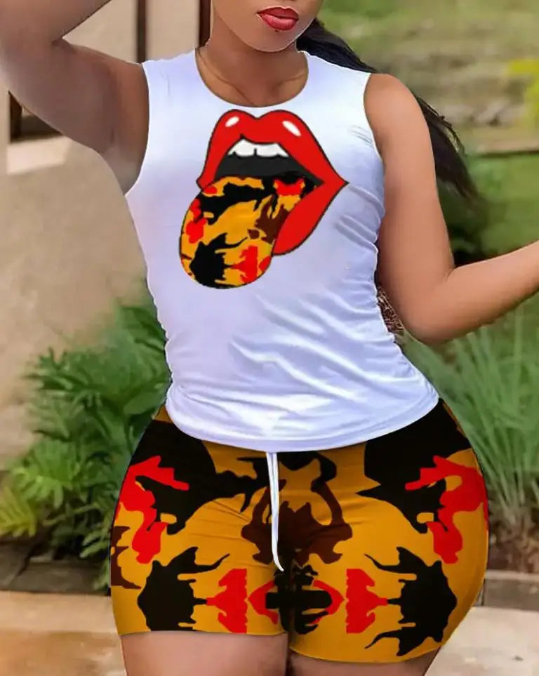 Woman wearing a white tank top with graphic lips and colorful leopard print shorts summer outfit