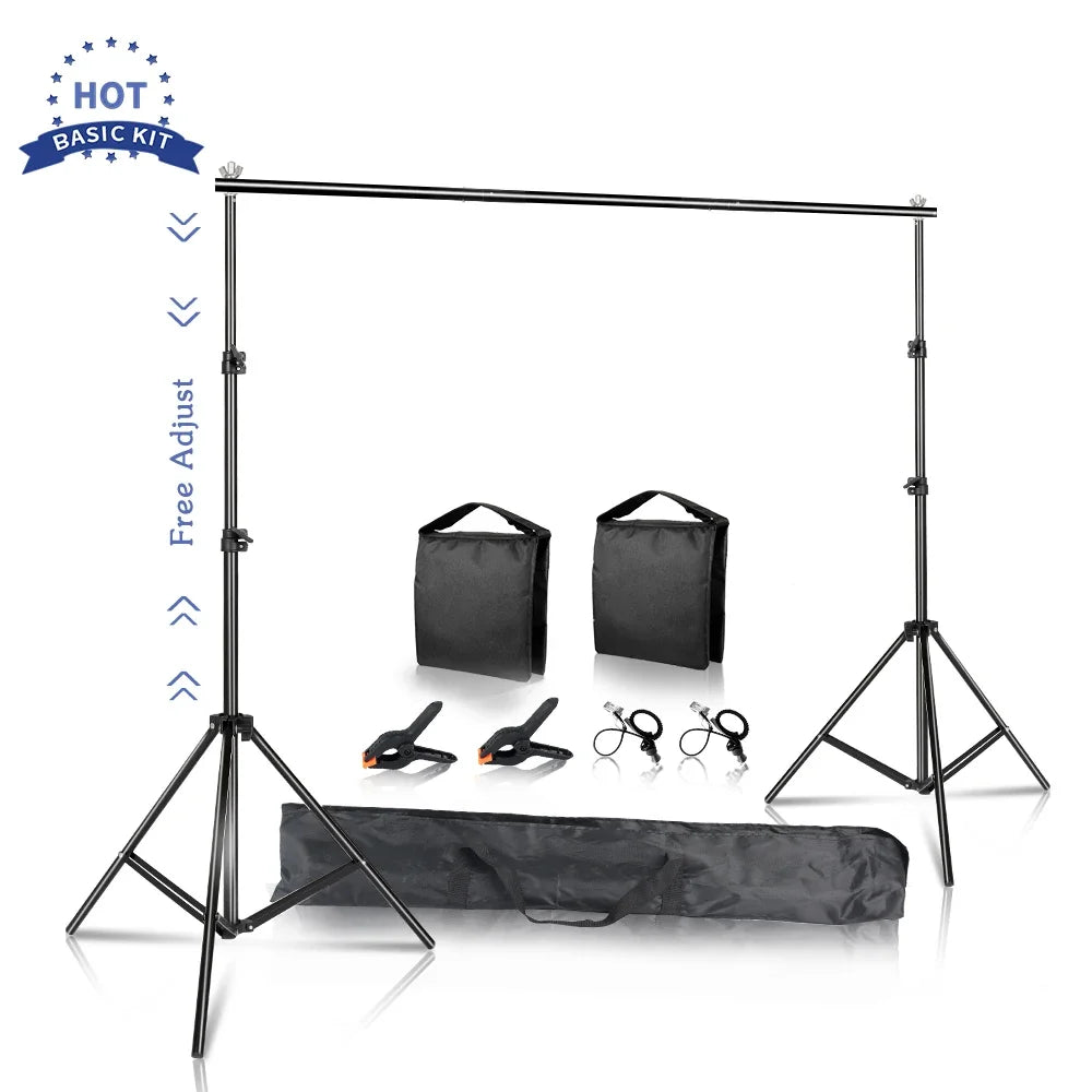 Adjustable black aluminum photo backdrop support stand with clamps and carrying bags on a white background