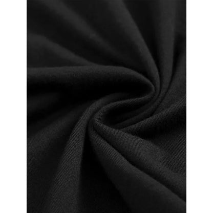 Close-up of soft black fabric texture twisted to show material quality for streetwear t-shirt design.