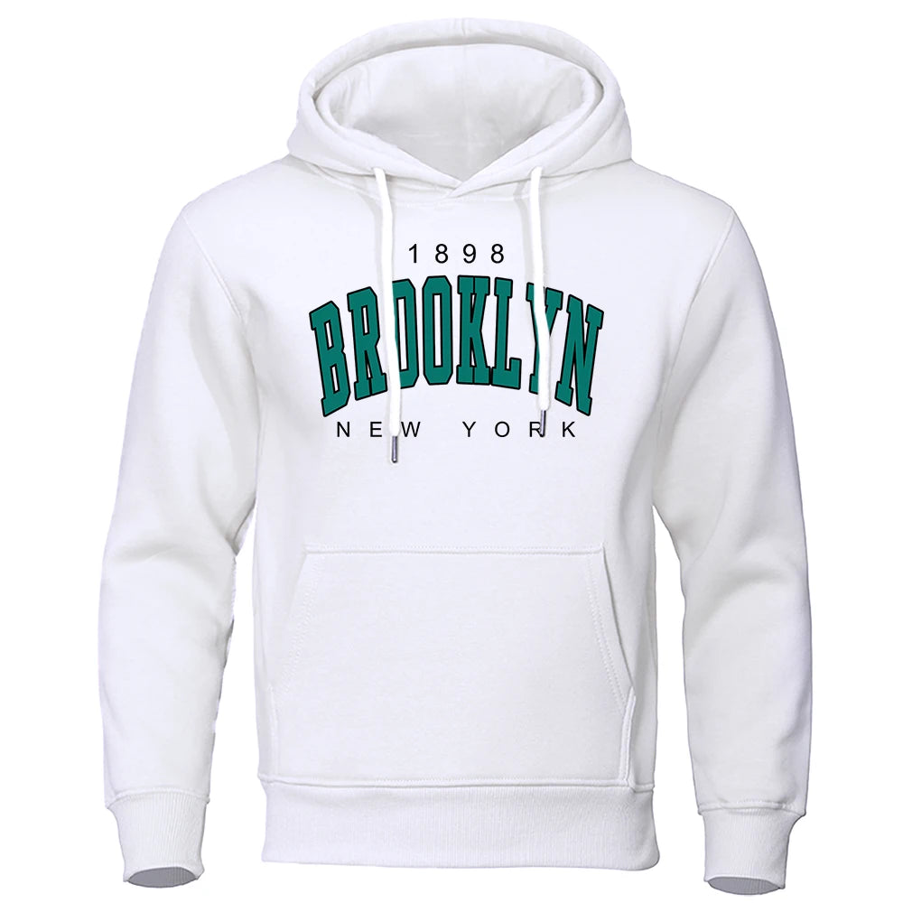 White urban hoodie for men with green Brooklyn New York graphic and kangaroo pocket on a white background