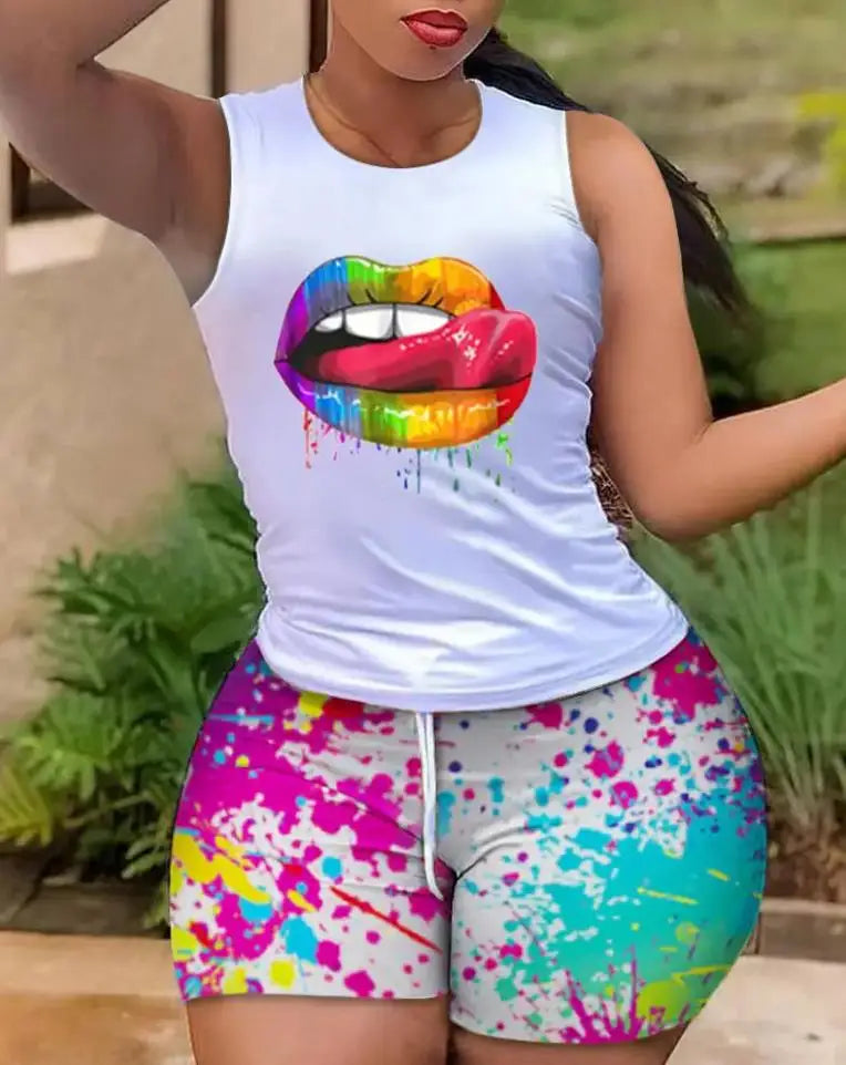Woman wearing colorful tie-dye shorts and white tank top with vibrant rainbow lips graphic design