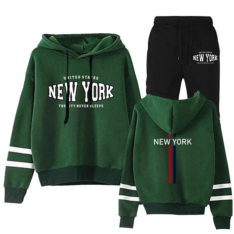 Women's two-piece jogging set with green striped hoodie and black sweatpants featuring New York print details