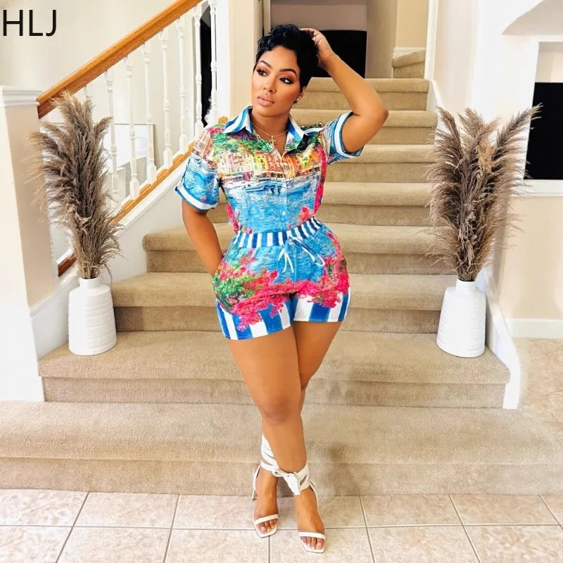 Woman wearing a colorful two-piece summer outfit with a short-sleeve collared top and matching shorts indoors