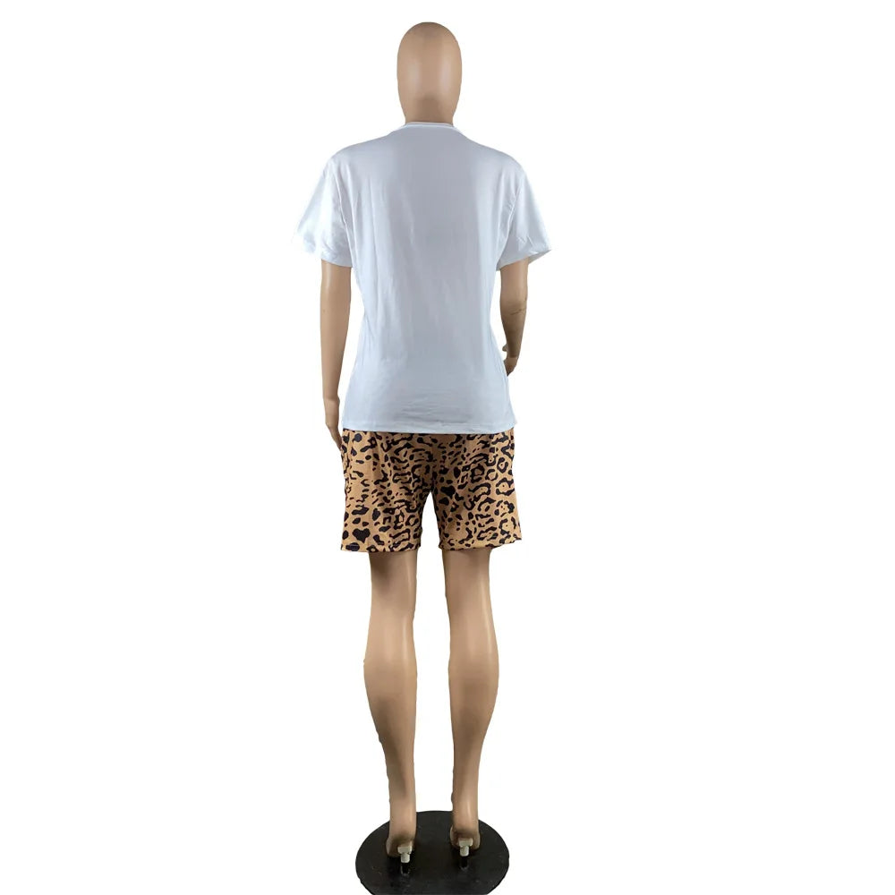 Mannequin wearing a white short-sleeve t-shirt and leopard print fitted shorts two-piece summer outfit back view