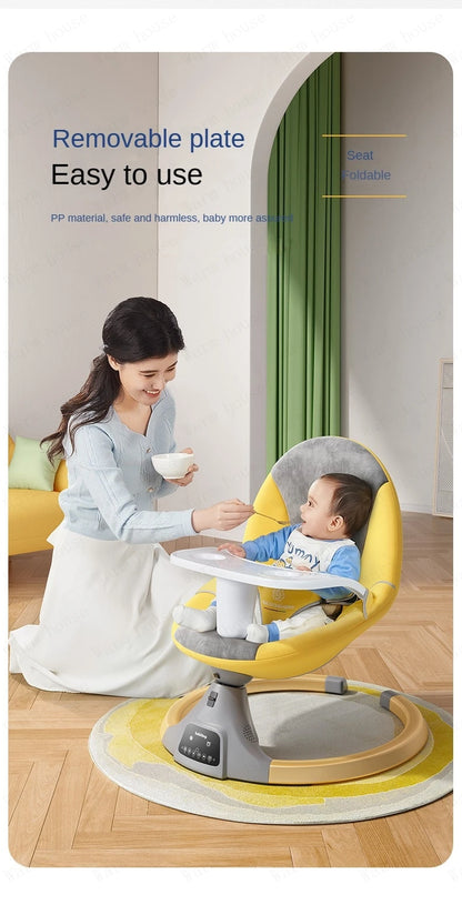 Mother feeding baby sitting in a yellow and gray electric rocking chair with removable tray in a modern living room