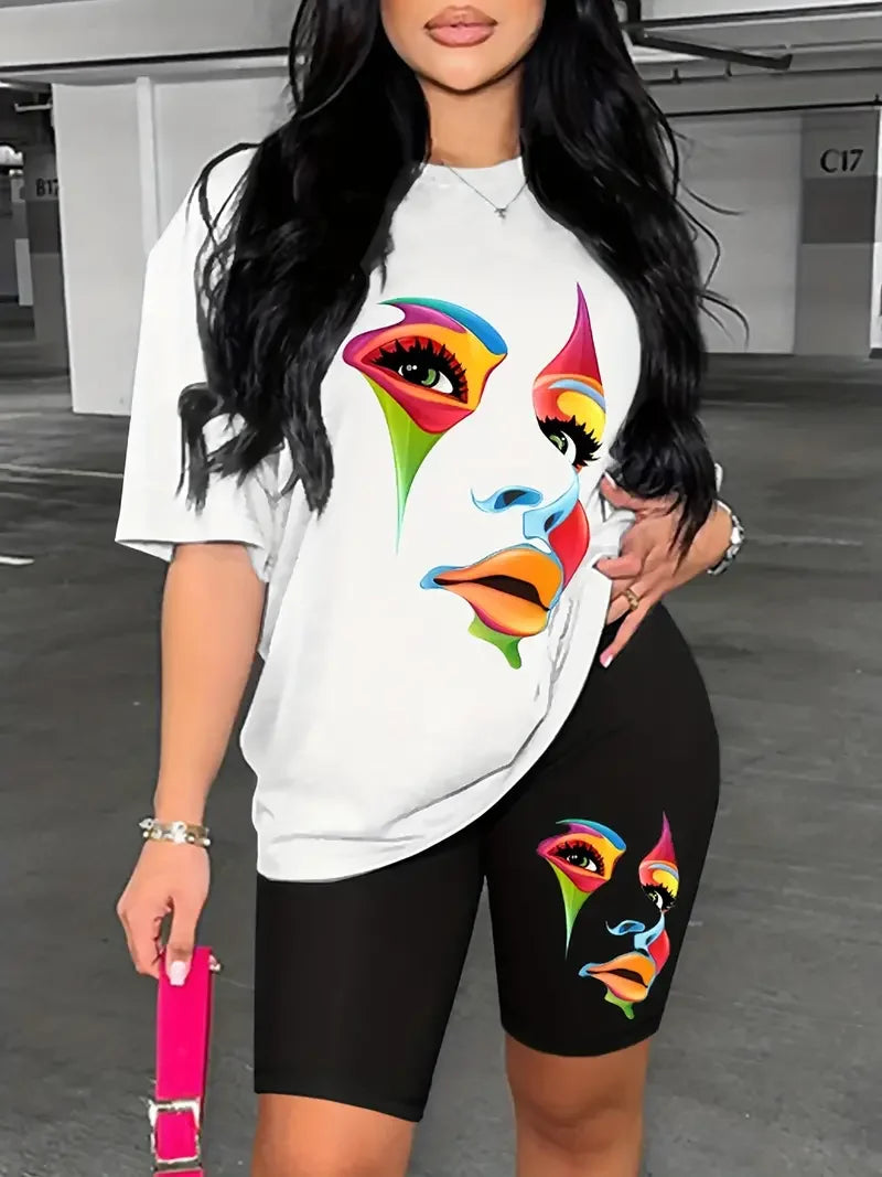 Woman wearing a two-piece outfit with a white oversized graphic t-shirt and black printed skinny shorts