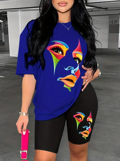 Woman wearing a chic two-piece set with a blue graphic t-shirt and black skinny shorts featuring matching colorful face prints
