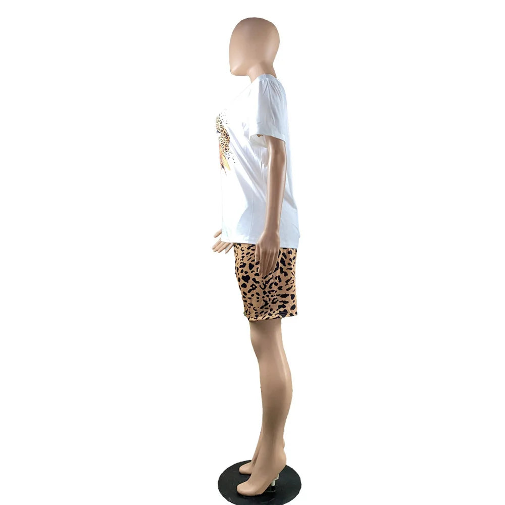 Female mannequin wearing a white graphic t-shirt and leopard print fitted shorts two-piece summer outfit side view