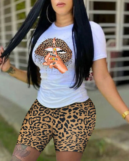 Woman wearing a summer two-piece outfit with leopard print shorts and a white graphic t-shirt with tie-dye lips design