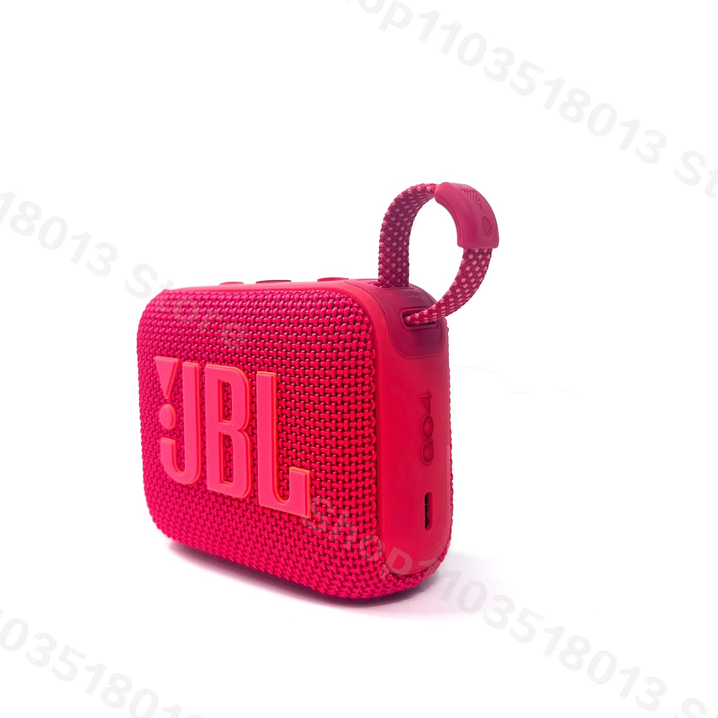 Red JBL GO 4 portable waterproof Bluetooth speaker with textured fabric and hanging loop on white background