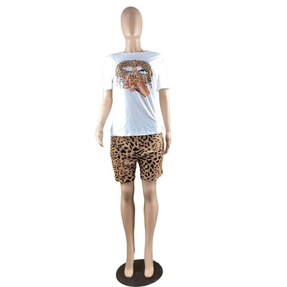 Female mannequin wearing a two-piece summer outfit with a white graphic t-shirt and leopard print fitted shorts