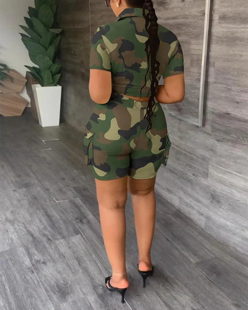 Woman wearing a camouflage two-piece summer outfit with a short-sleeve top and high-waisted shorts with pockets