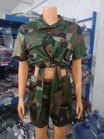Mannequin wearing a two-piece summer outfit with camo print tied crop top and matching cargo shorts with pockets