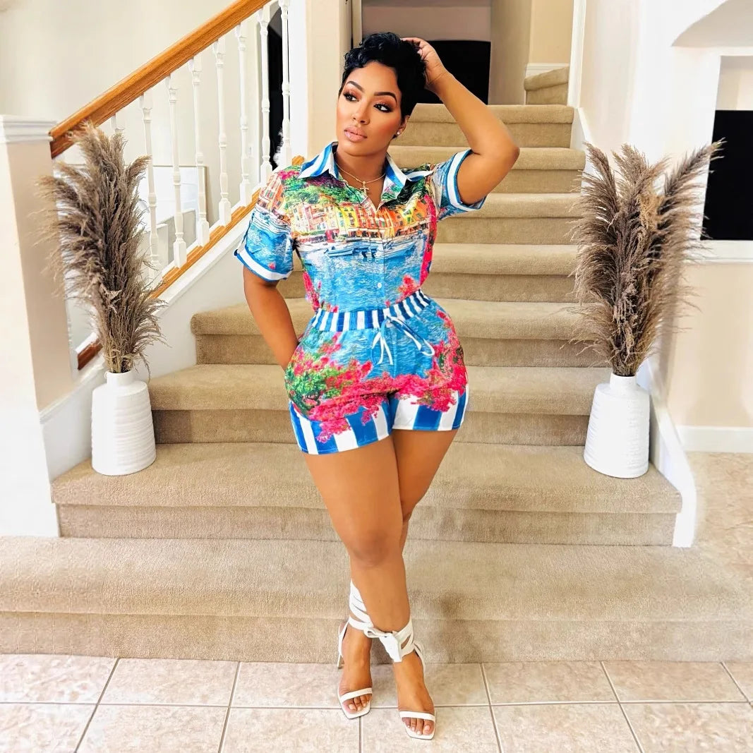 Woman wearing a colorful two-piece vacation outfit with a short-sleeve collared top and matching shorts