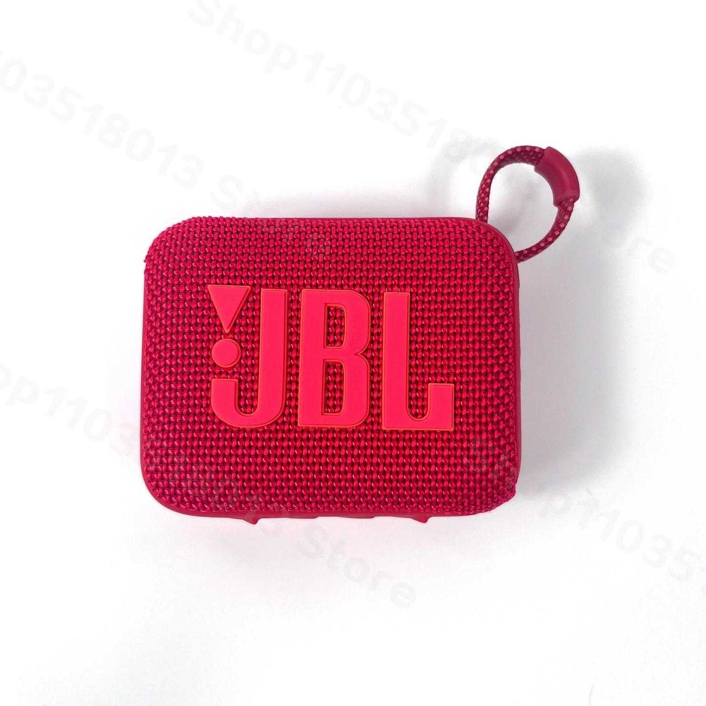 Red JBL GO 4 portable waterproof Bluetooth speaker with fabric texture and attached carrying loop on white background