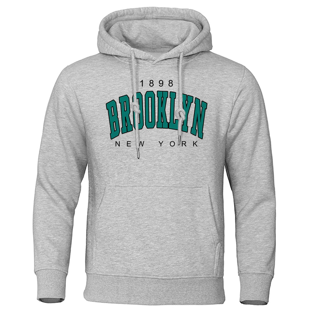 Gray men's hoodie with Brooklyn New York vintage print, front pocket, and adjustable drawstring hood