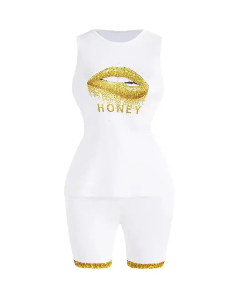 White sleeveless top and shorts set with gold glitter lips and honey text, featuring gold glitter trim on shorts.
