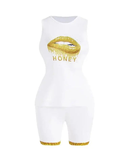 White sleeveless top and shorts set with gold glitter lips and honey text, featuring gold glitter trim on shorts.