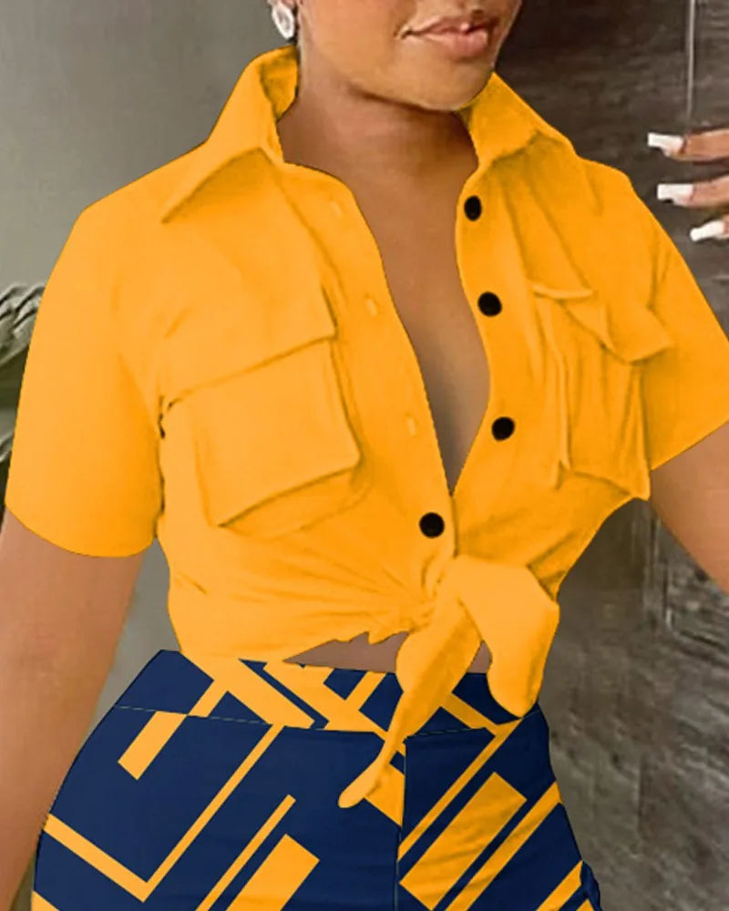 Woman wearing a summer two-piece outfit with a tied yellow short-sleeve top and patterned high-waisted shorts