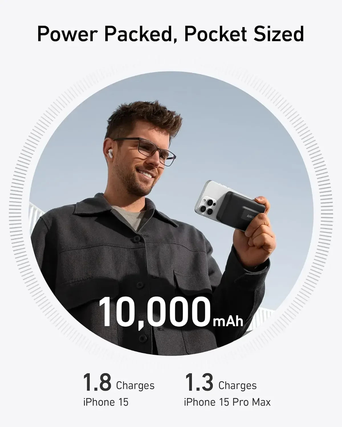 Man wearing glasses holding phone with black magnetic power bank showing 10,000mAh capacity and fast charging stats