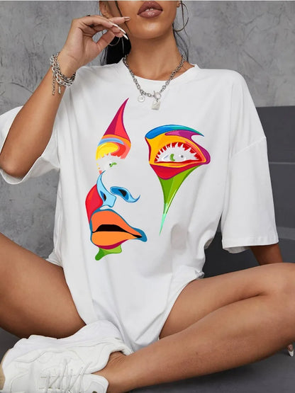 Woman wearing a white oversized t-shirt with colorful artistic painted face graphic and casual accessories